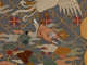 Robe’s back detail, showing a monk flailing on the ground, amongst earthy pastel clouds, a flying white bird, against a dark background with a diagonally running grid and floral motifs.