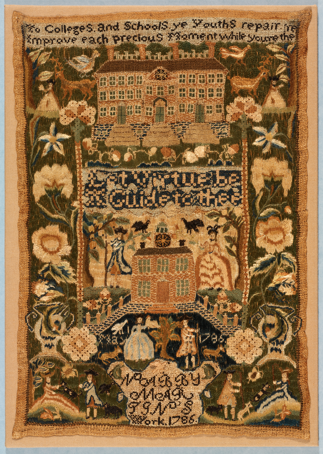 Ornate needlework depicting floral blooms, figures and animals, houses, and embroidered text along the top and bottom edges. 