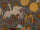 Detail of the robe, featuring a white bird beside two golden circles. The background is dark with a golden diagonal grid, within each square is a floral motif.