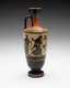 Tall vase with a slender neck. Its tan-orange surface is decorated with black illustrations of robed figures walking and carrying branch-like objects and jars, as well as stripe patterns. 