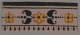 Horizontal decorative design on a white backdrop with black borders and three yellow flowers above a teardrop pattern. The center flower is surrounded by symmetrical black leaves and dots.