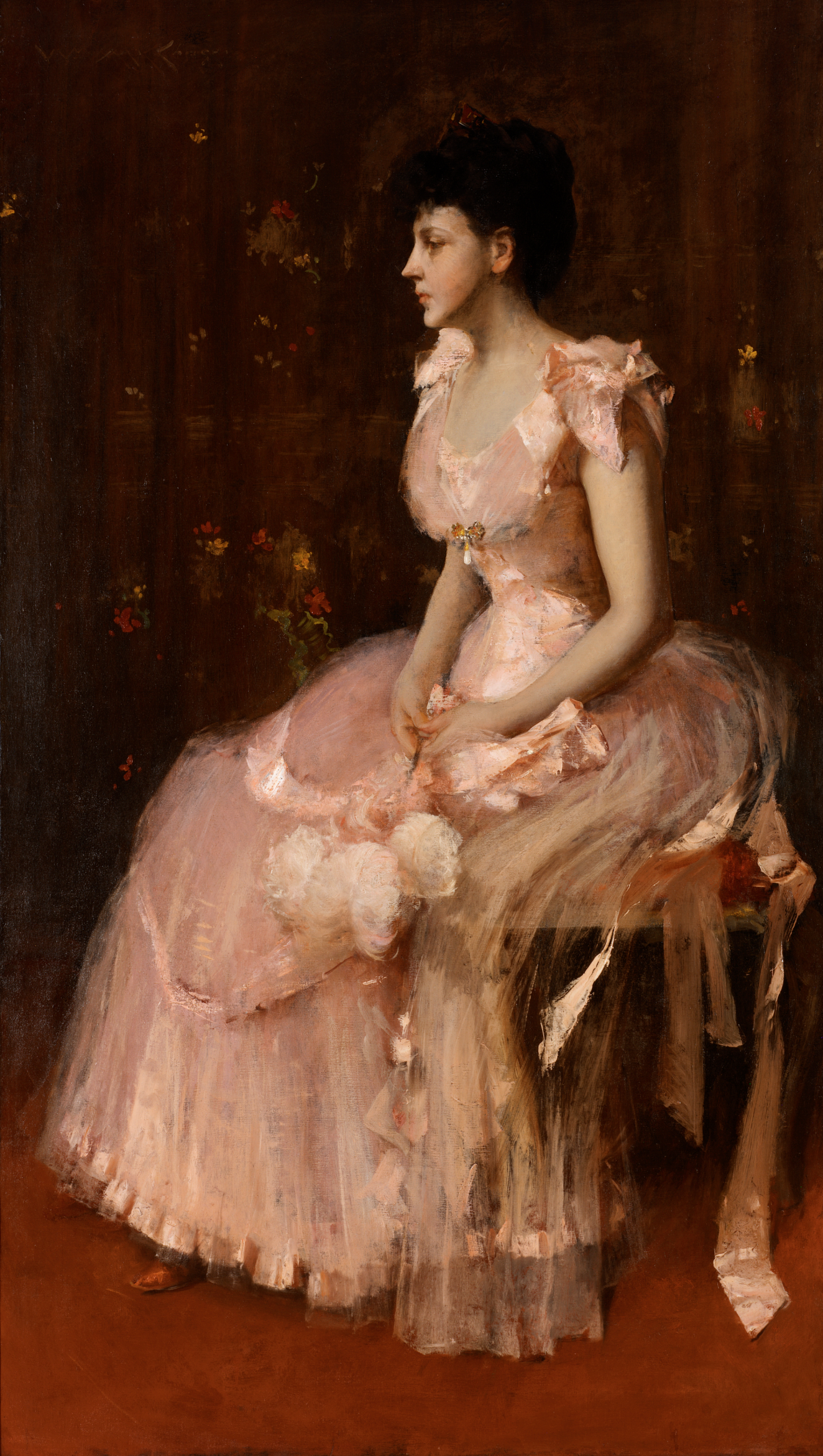 A fair-skinned figure with dark hair in a pink gown with soft ruffles and subtle floral details, sitting gracefully and gazing to the side against a dark burgundy background. 