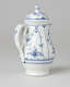 A white chocolate pot with delicate blue decorations with ribbed body, spout, handle, and foot.