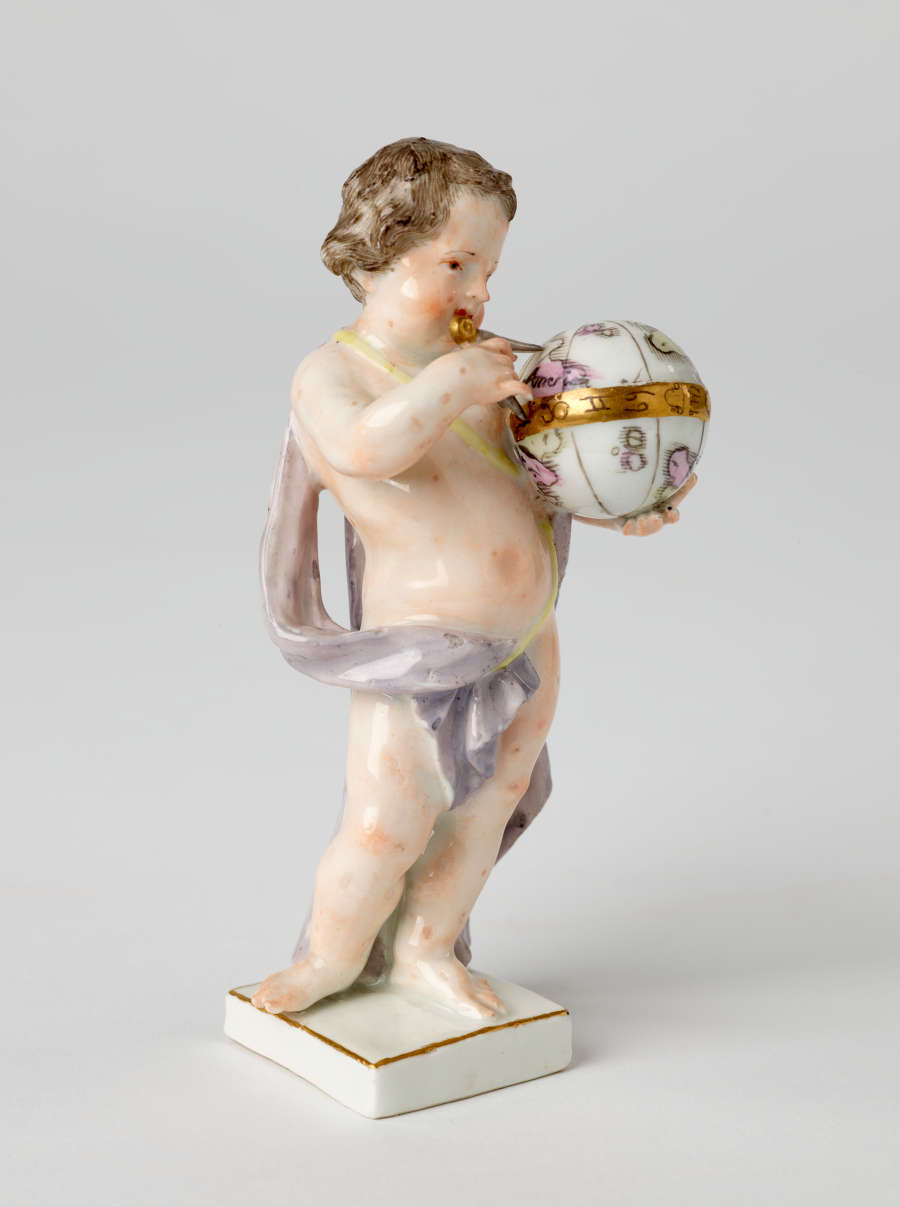 A sculptural putto figure holding a globe banded with gold. The putto has brown hair, red lips, and a light purple fabric draped across their body.