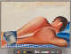 Stylized painting of the back of a tanned, muscled, dark-haired figure wearing blue shorts, relaxing on a blue checked cloth. He turns from the viewer, his legs cropped from view.
