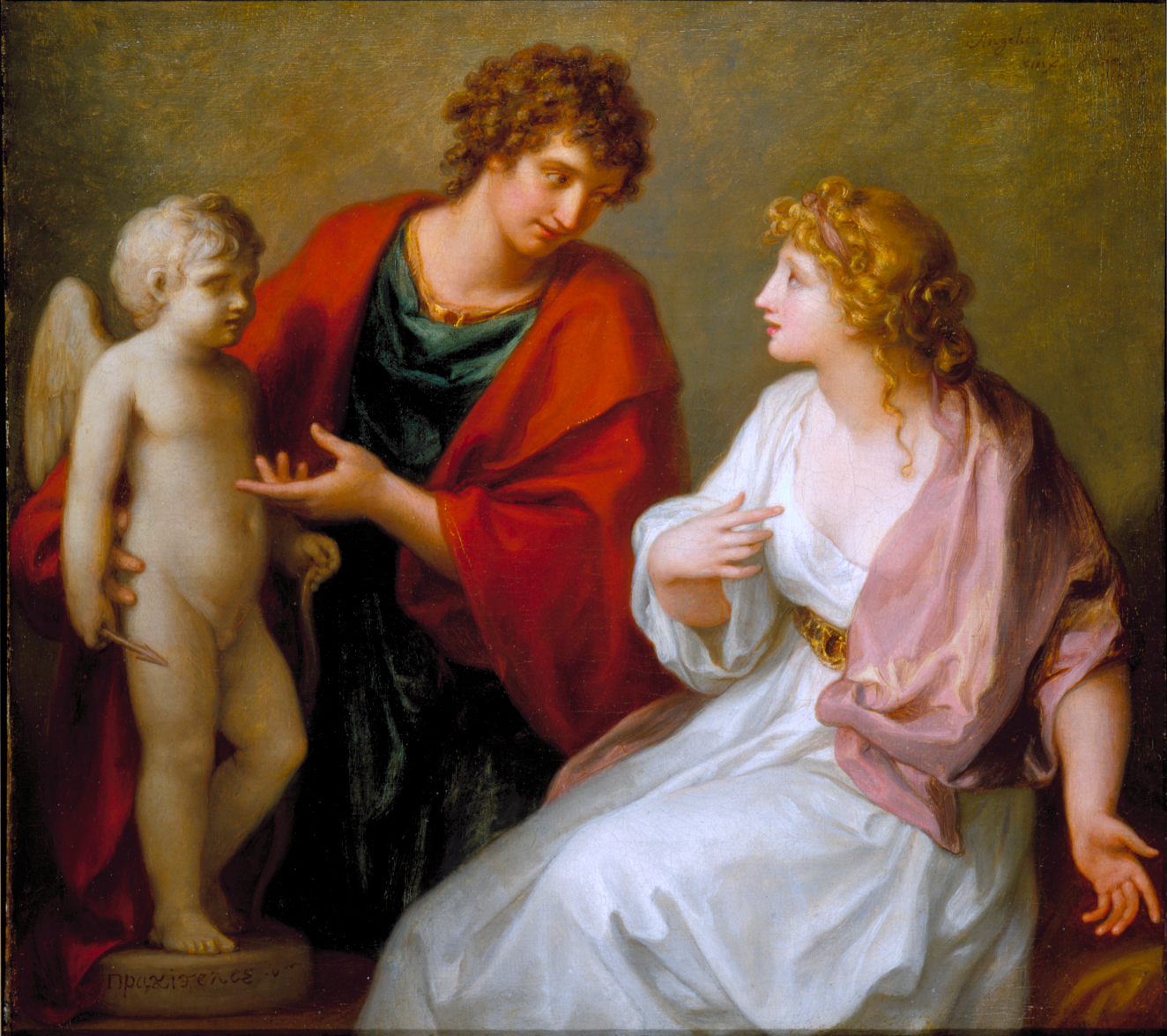 A seated fair-skinned woman in white and pink robes with curled blond hair looks toward a man in red and green garments presenting a small winged statue holding an arrow and snake.