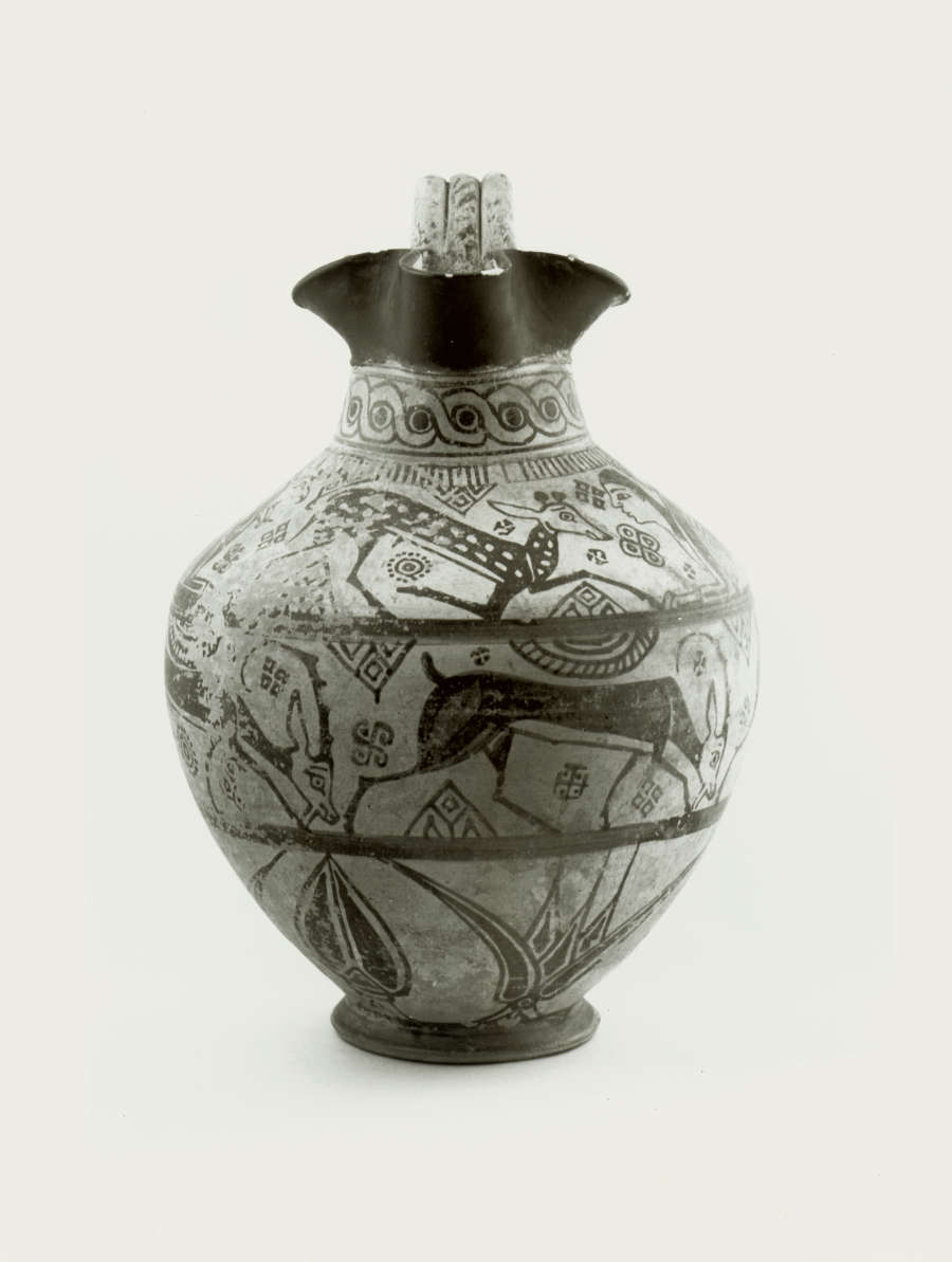 Monochrome front-view of an onion-shaped jug with a flared mouth, decorated with three bands of floral and animal illustrations. The mouth is painted black while the neck is patterned.
