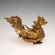 Connected top and bottom of a golden dragon-like bird container with embedded gems. The lid forms a dragon-like bird’s body, while the base is a cup-like stand.